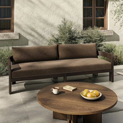 Jackson Outdoor Sofa by Four Hands. Made from 100% olefin, solid fsc®-certified teak, 91% polyurethane foam pad, 9% polyester fiber batting in a modern style.