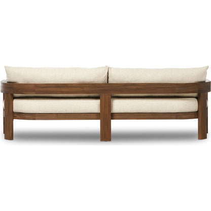 Jackson Outdoor Sofa by Four Hands. Made from 100% olefin, solid fsc®-certified teak, 91% polyurethane foam pad, 9% polyester fiber batting in a modern style.