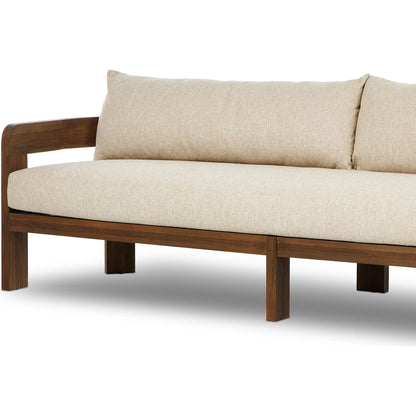 Jackson Outdoor Sofa by Four Hands. Made from 100% olefin, solid fsc®-certified teak, 91% polyurethane foam pad, 9% polyester fiber batting in a modern style.