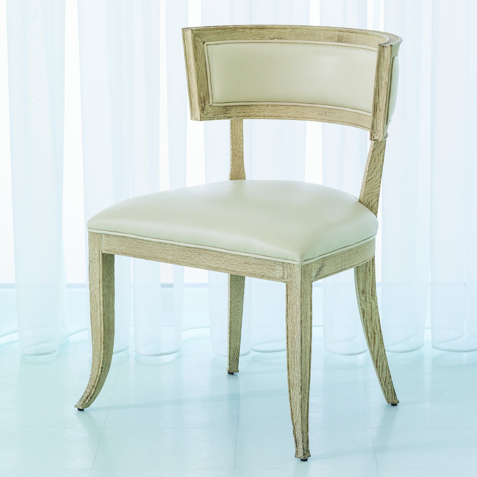Klios Chair by Global Views. Made from american white oak in a transitional style.