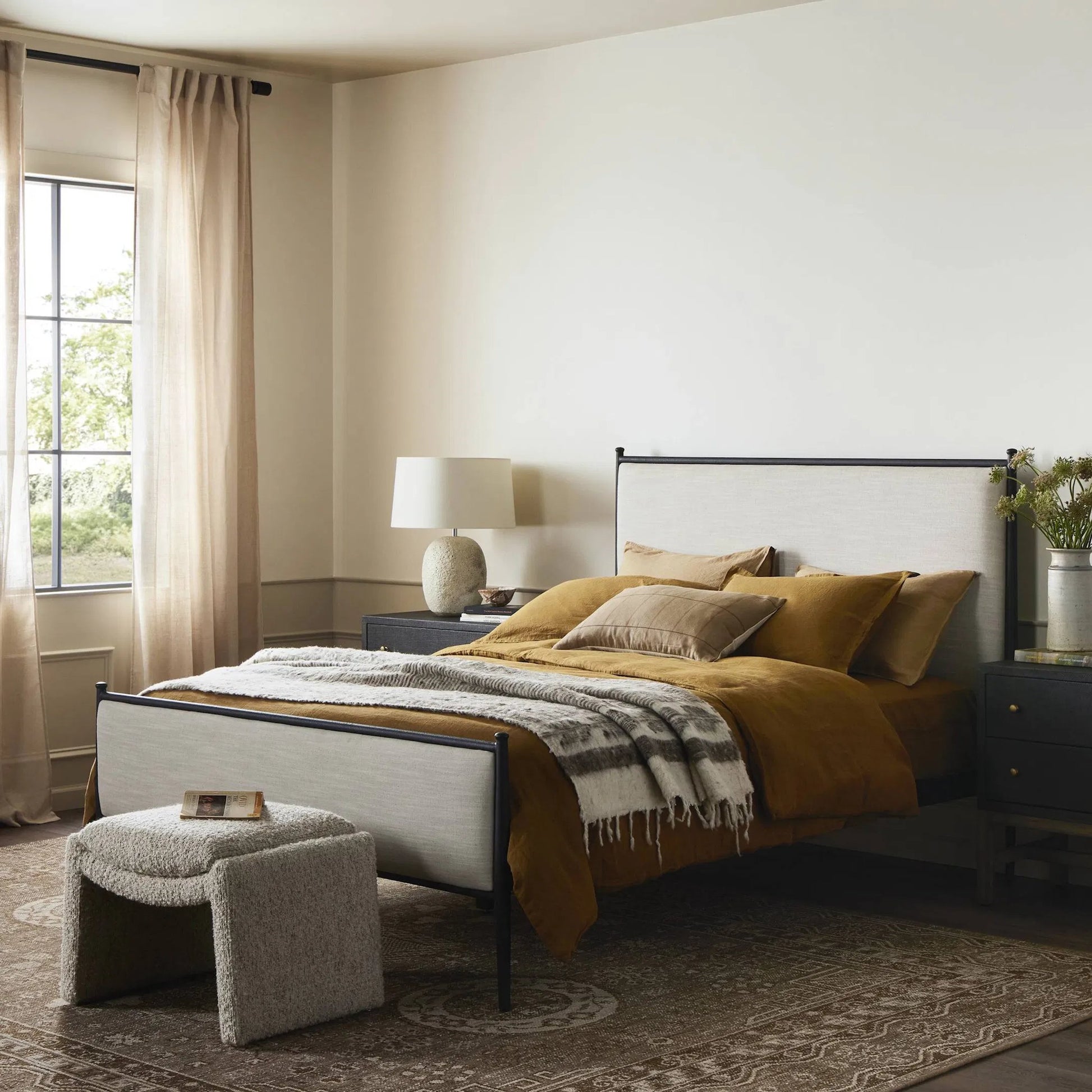 Xander Bed by Four Hands in savoy parchment, textured black iron. Made from unique in a transitional style.