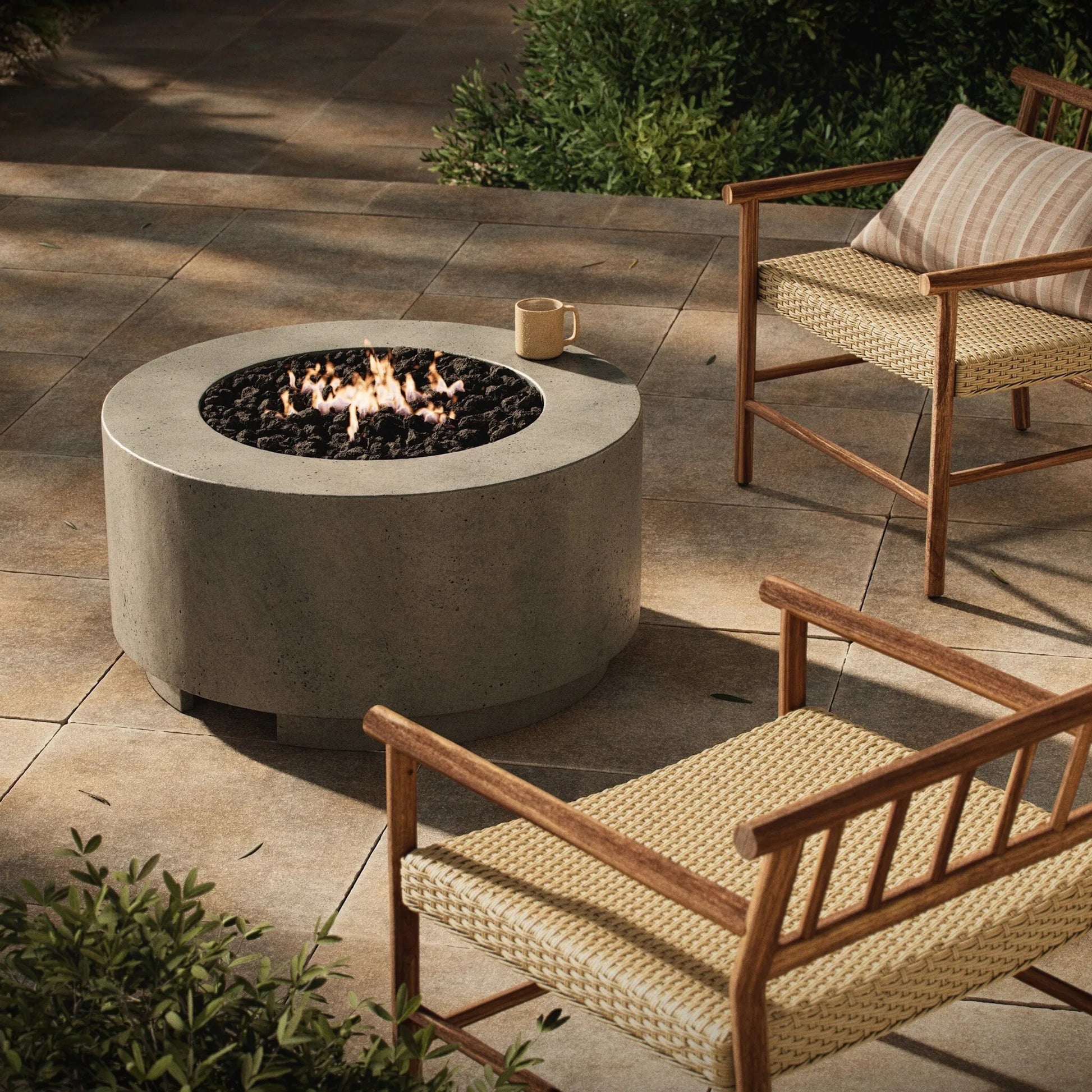 Damian Outdoor Fire Table by Four Hands. Made from concrete in a modern style.
