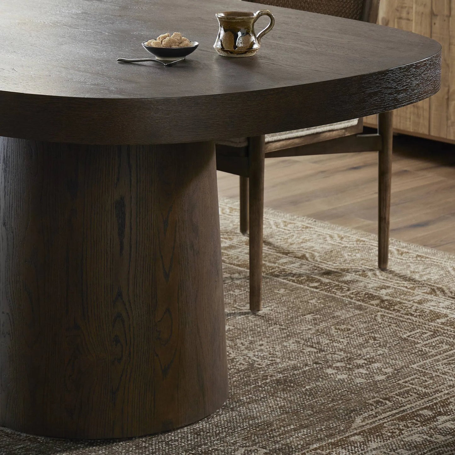 010 SI-2519331 | Closeup | Valen Dining Table by Four Hands in rustic brown oak veneer. Made from oak veneer in a traditional style.