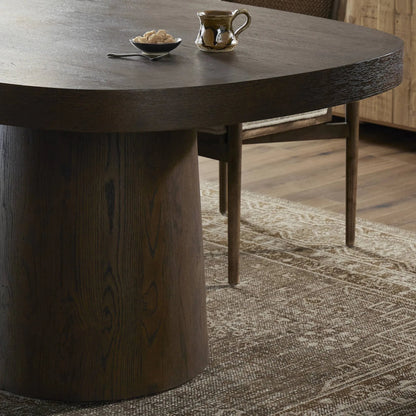 Valen Dining Table by Four Hands in rustic brown oak veneer. Made from oak veneer in a traditional style.