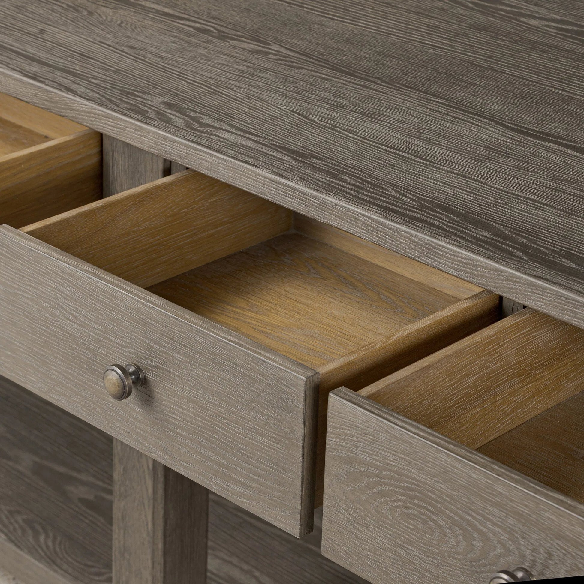 Elise Kitchen Island by Four Hands in weathered hazel oak veneer, dark brass. Made from oak veneer, brass in a unique style.