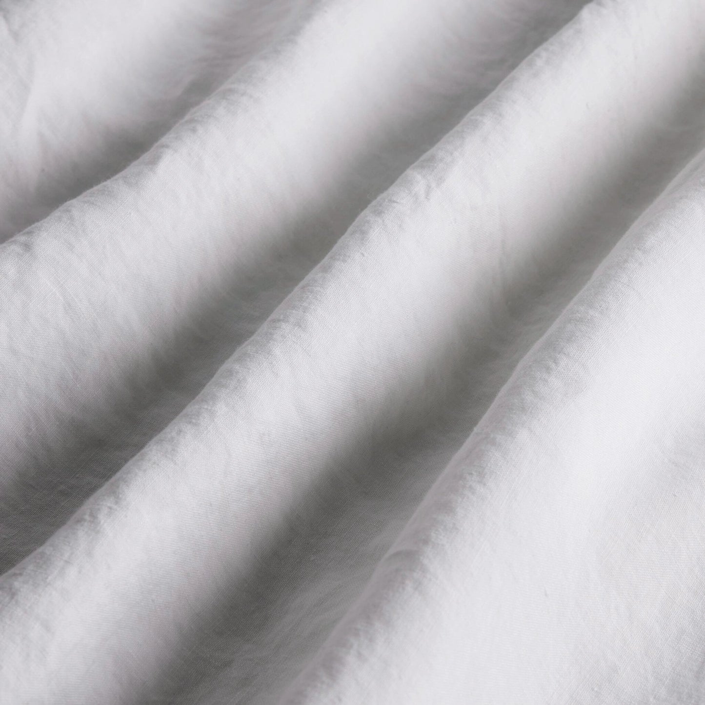 012 SI-2158454 | Closeup | Sable Flat Sheet by Four Hands. Made from 100% flax/linen in a modern style.