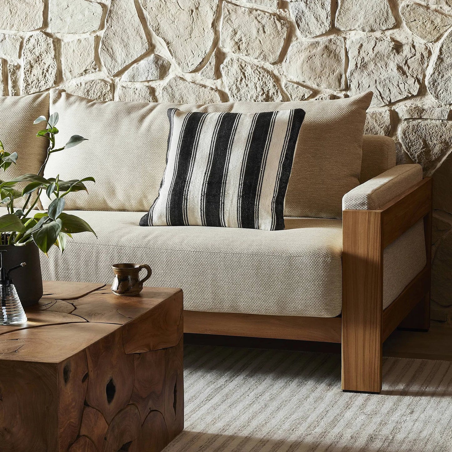 006 SI-2635292 | Lifestyle | Ditmar Outdoor Pillow by Four Hands in ditmar black, cream outdoor backing. Made from 100% polyethylene terephthalate (pet) in a unique style.