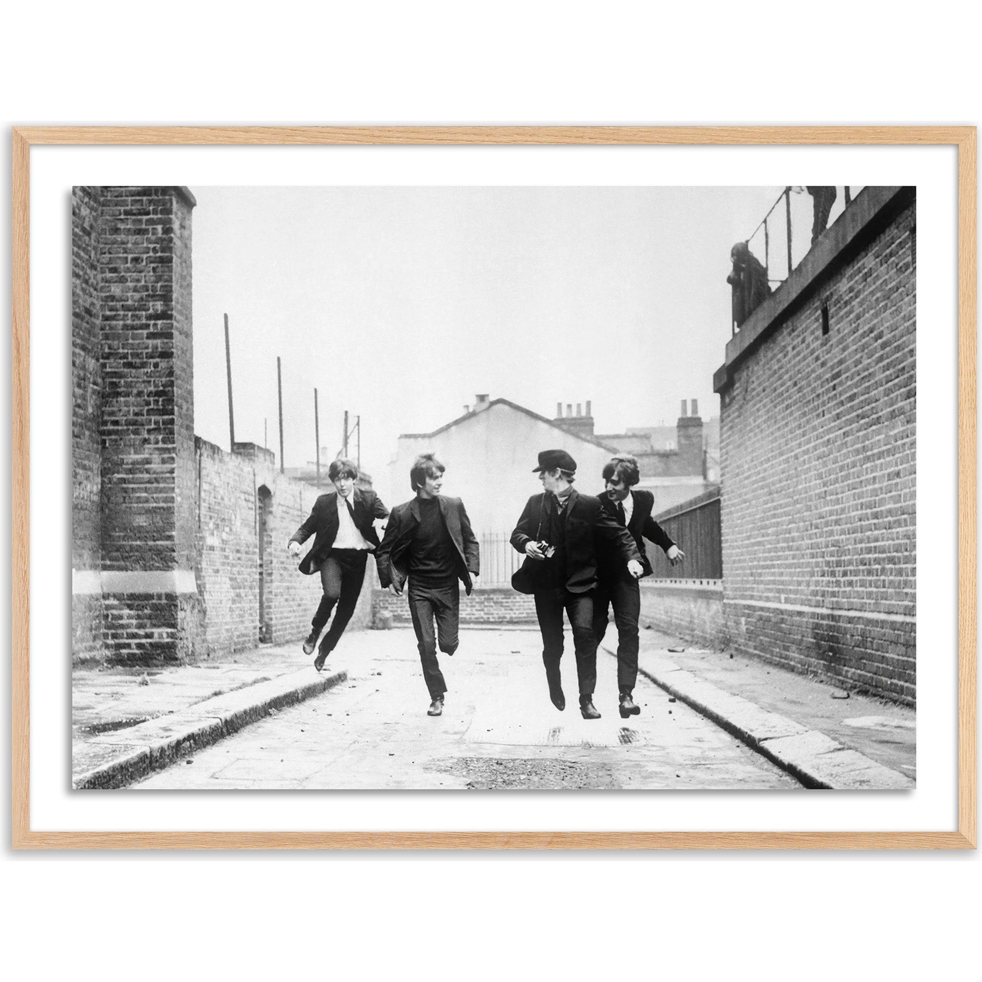 The Beatles Running in a Hard Day's Night by Getty Images by Four Hands. Made from acrylic glazing in a modern style.