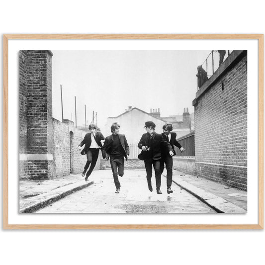 The Beatles Running in a Hard Day's Night by Getty Images by Four Hands. Made from acrylic glazing in a modern style.