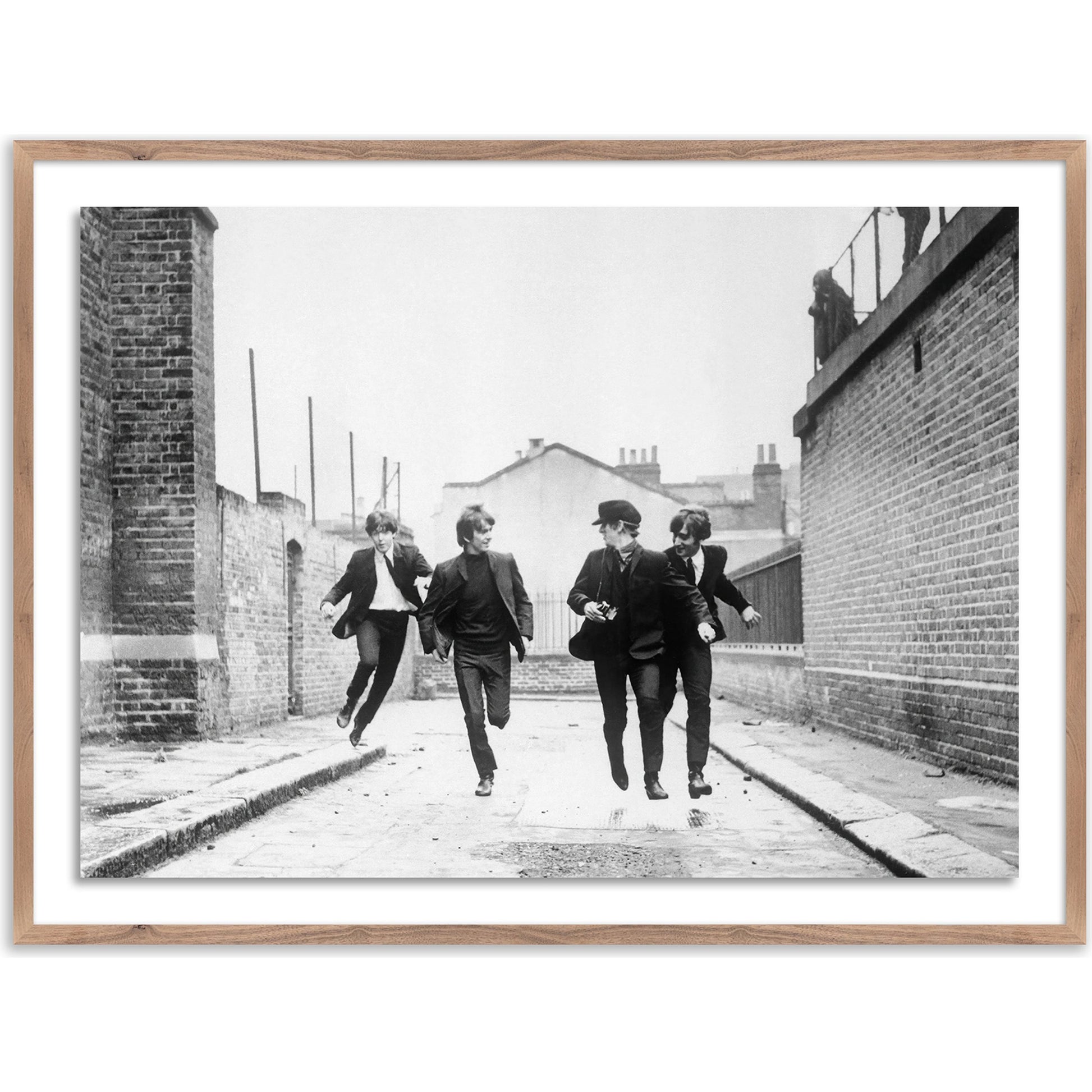 The Beatles Running in a Hard Day's Night by Getty Images by Four Hands. Made from acrylic glazing in a modern style.