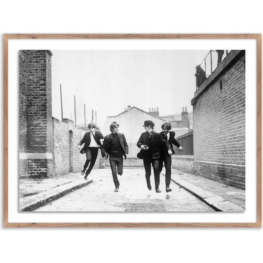 The Beatles Running in a Hard Day's Night by Getty Images by Four Hands. Made from acrylic glazing in a modern style.