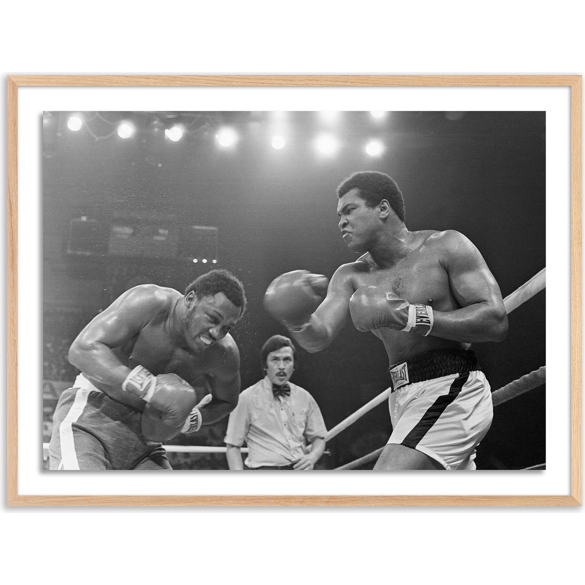 Muhammad Ali Punching Joe Frazier by Getty Images by Four Hands. Made from unique in a modern style.