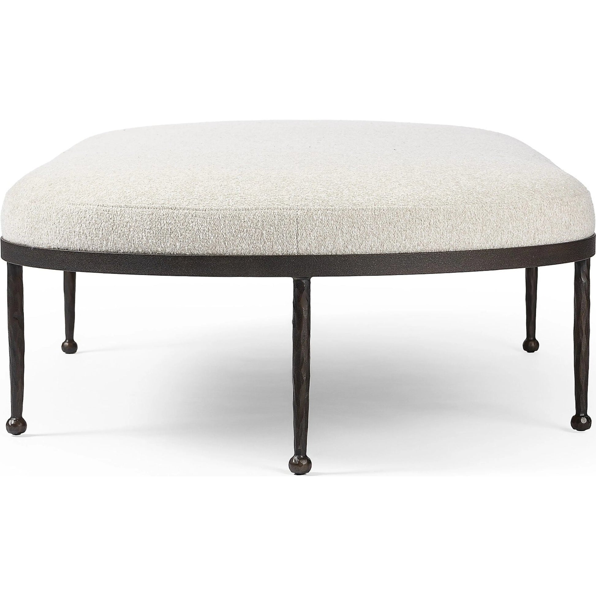 Corinne Cocktail Ottoman by Four Hands in crete pebble, hammered bronze, textured bronze. Made from 100% post consumer recycled polypropylene, iron in a unique style.