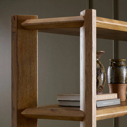 Orwin Wide Bookshelf by Four Hands in worn oak, worn oak veneer. Made from solid oak, oak veneer in a transitional style.