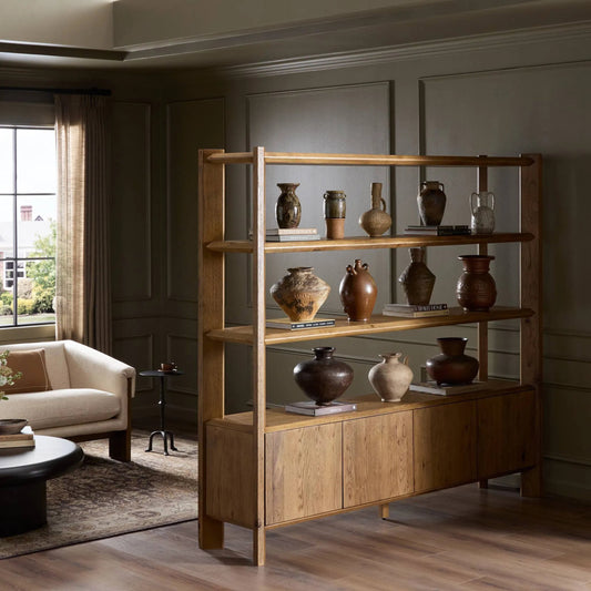 Orwin Wide Bookshelf by Four Hands in worn oak, worn oak veneer. Made from solid oak, oak veneer in a transitional style.
