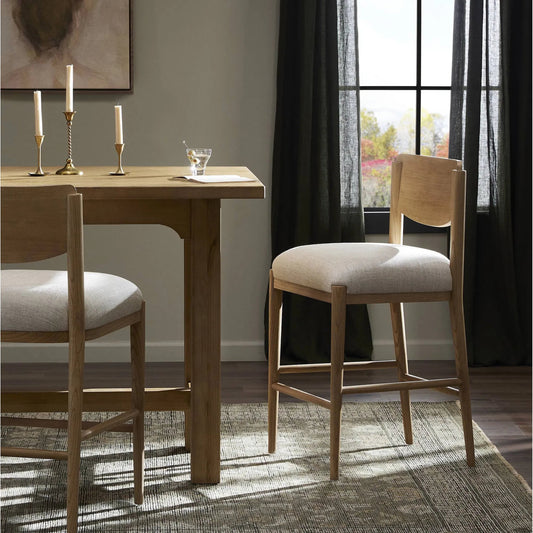 Piran Bar Stool by Four Hands in essence natural, natural nettlewood, natural ash veneer. Made from 49% viscose (rayon), 22% flax/linen, 18% polyester, 11% cotton, solid nettlewood, ash veneer in a unique style.