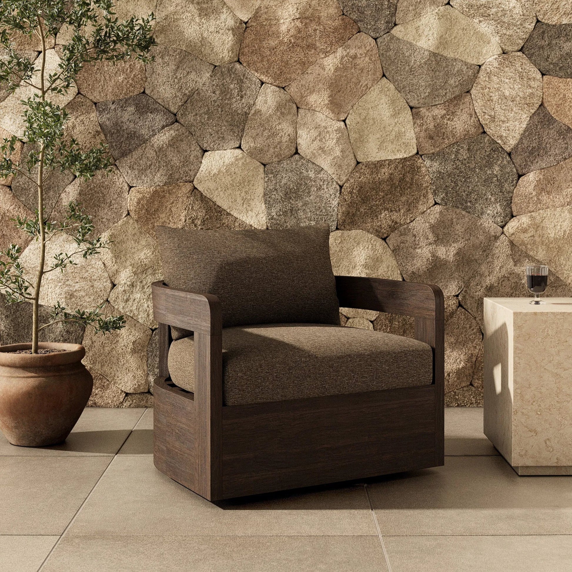 Jackson Outdoor Swivel Chair by Four Hands. Made from 100% olefin, solid fsc®-certified teak in a modern style.