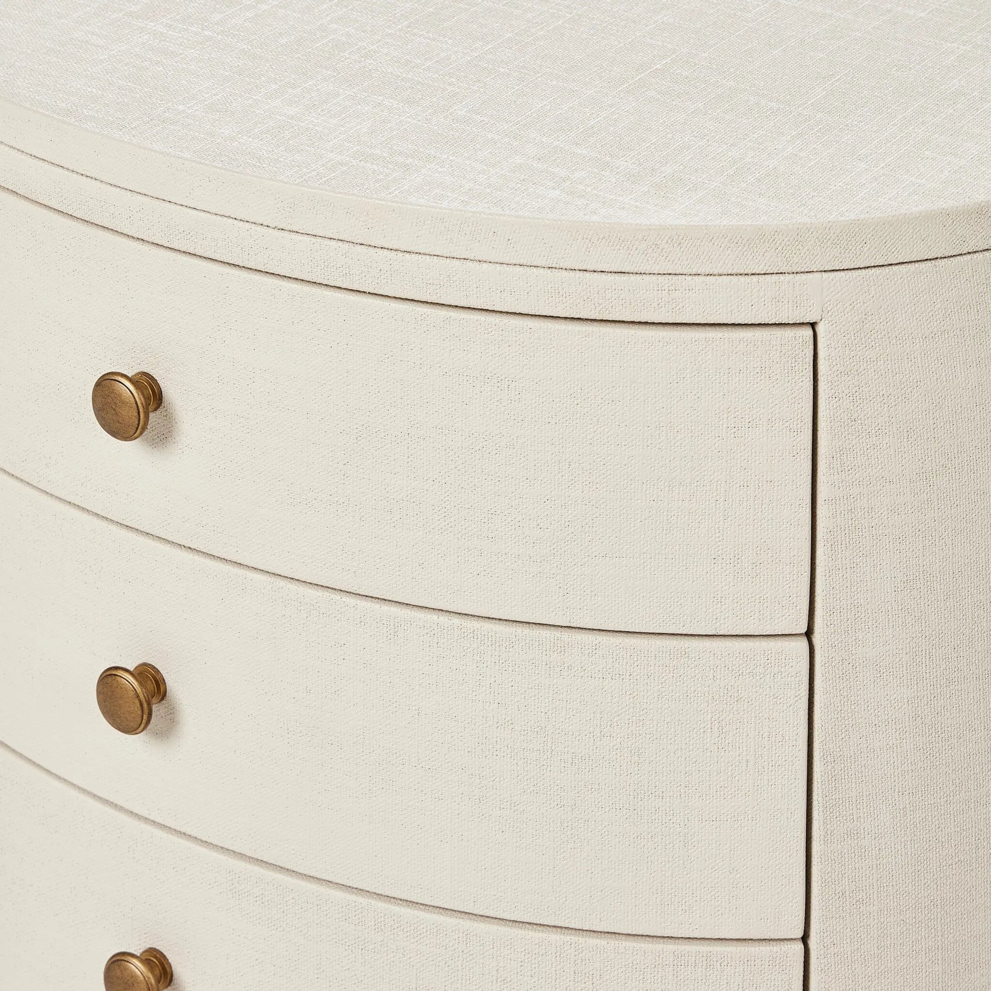 Amelia Oval Nightstand by Four Hands in ivory painted linen. Made from painted linen in a transitional style.