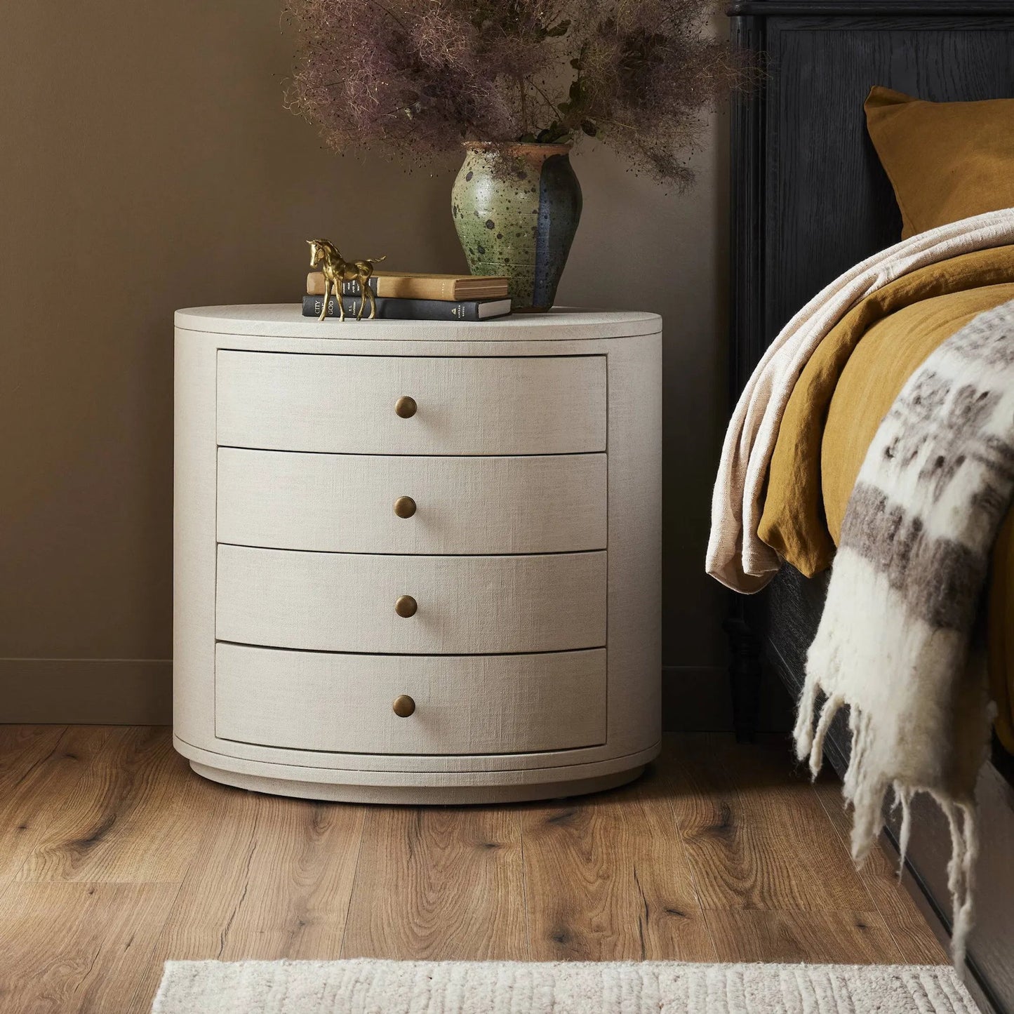 012 SI-2377029 | Lifestyle | Amelia Oval Nightstand by Four Hands in ivory painted linen. Made from painted linen in a transitional style.