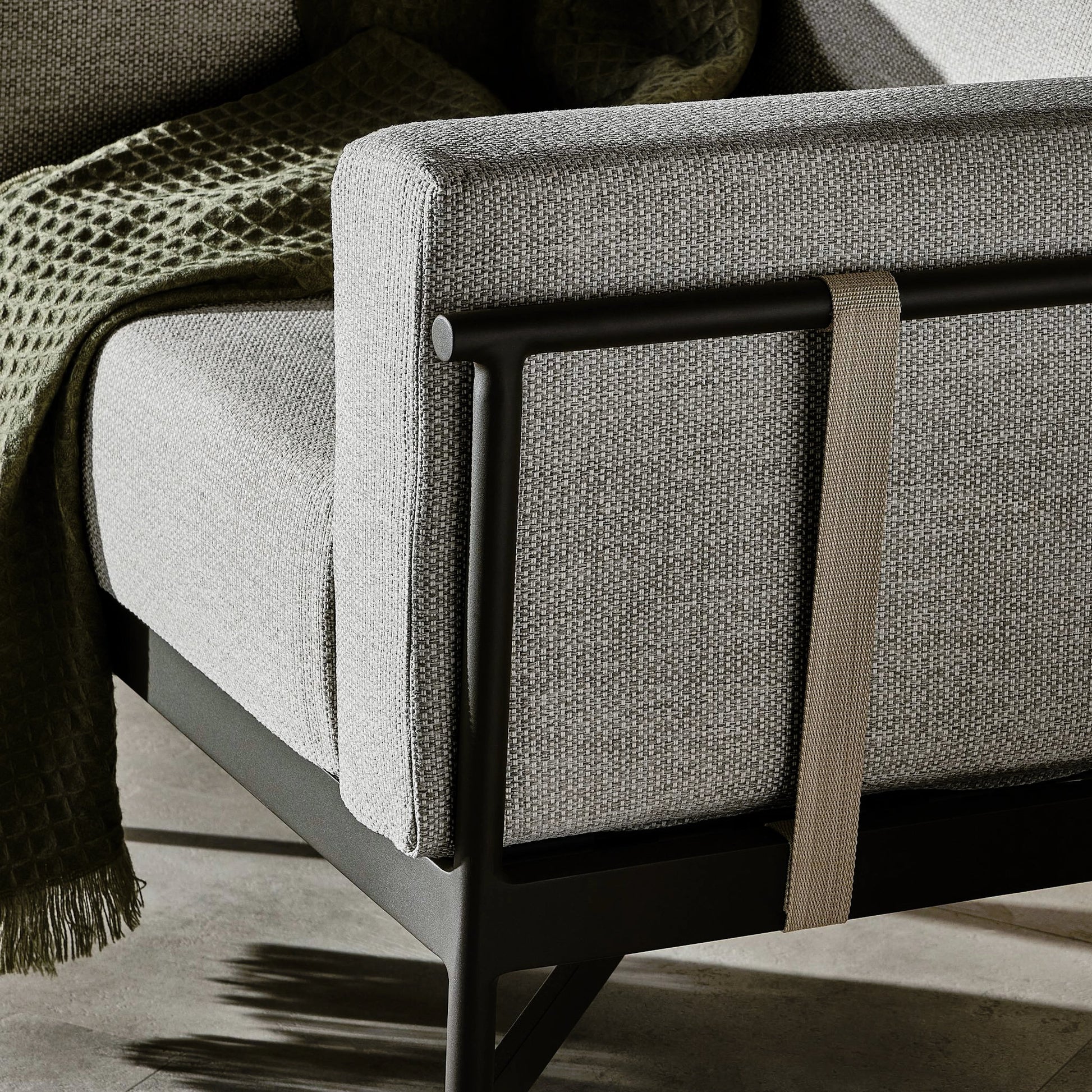 Hearst Outdoor Chair by Four Hands in bronze. Made from 100% olefin, aluminum, 100% polypropylene in a modern style.