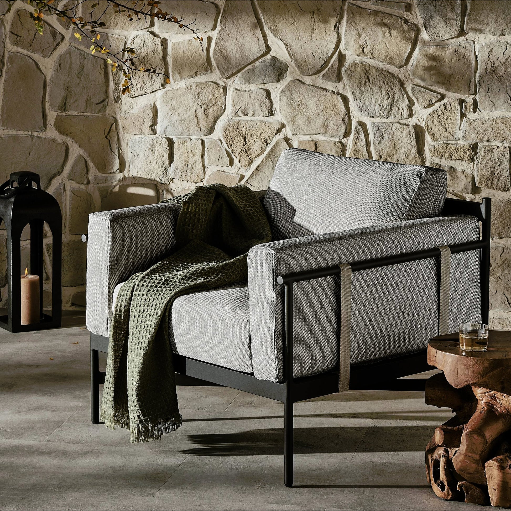 Hearst Outdoor Chair by Four Hands in bronze. Made from 100% olefin, aluminum, 100% polypropylene in a modern style.