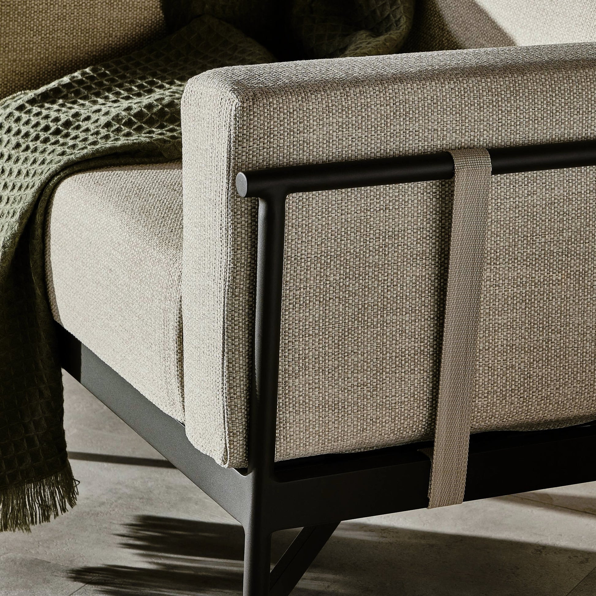 Hearst Outdoor Chair by Four Hands in bronze. Made from 100% olefin, aluminum, 100% polypropylene in a modern style.