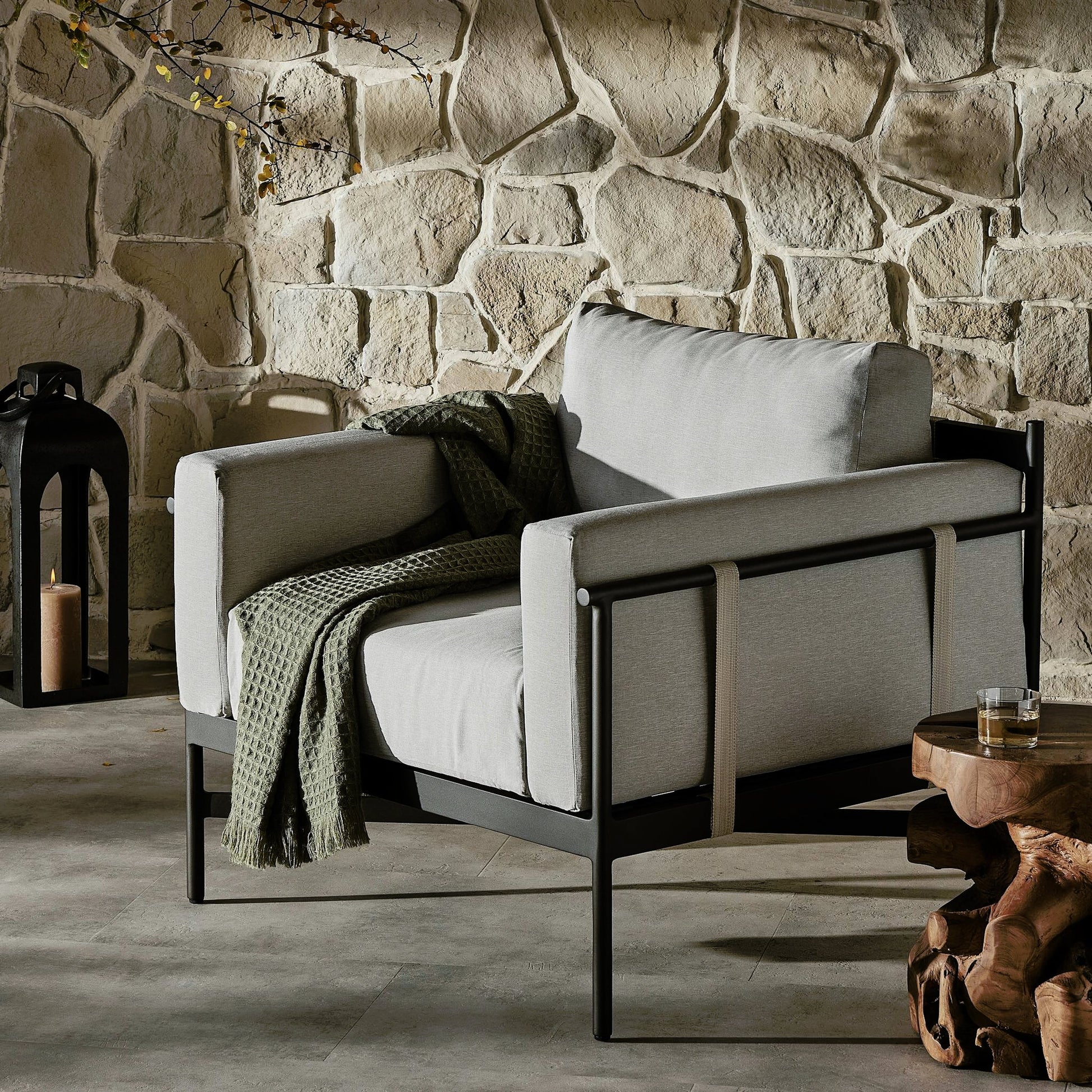 Hearst Outdoor Chair by Four Hands in bronze. Made from 100% olefin, aluminum, 100% polypropylene in a modern style.