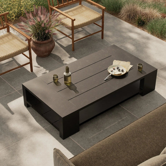 Roca Outdoor Metal Coffee Table by Four Hands in bronze. Made from aluminum in a unique style.
