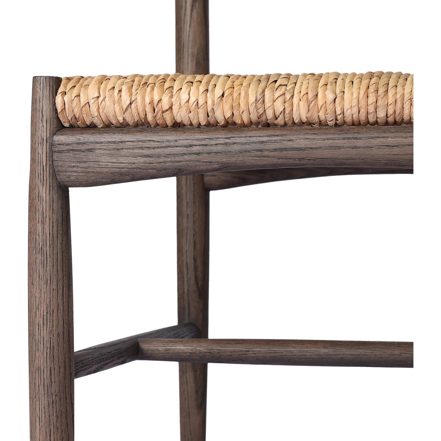 009 SI-2327566 | Closeup | Jovan Dining Chair by Four Hands in stained saddle brown, slight dark bleaching. Made from solid oak, banana leaf in a traditional style.