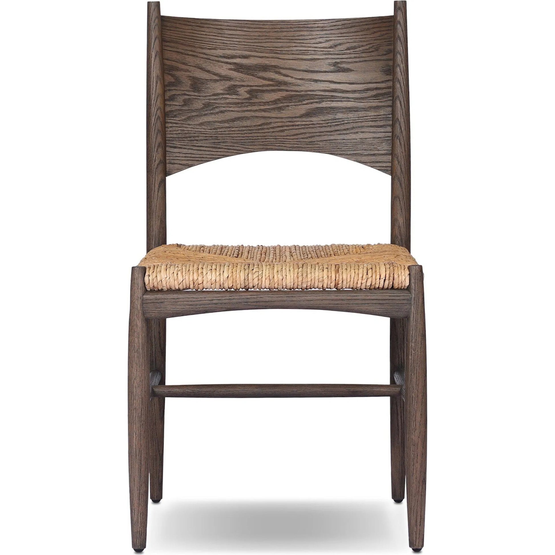 Jovan Dining Chair by Four Hands in stained saddle brown, slight dark bleaching. Made from solid oak, banana leaf in a traditional style.