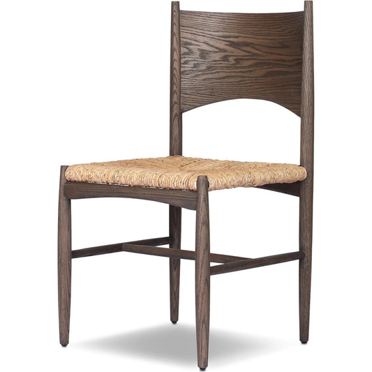 Jovan Dining Chair by Four Hands in stained saddle brown, slight dark bleaching. Made from solid oak, banana leaf in a unique style.