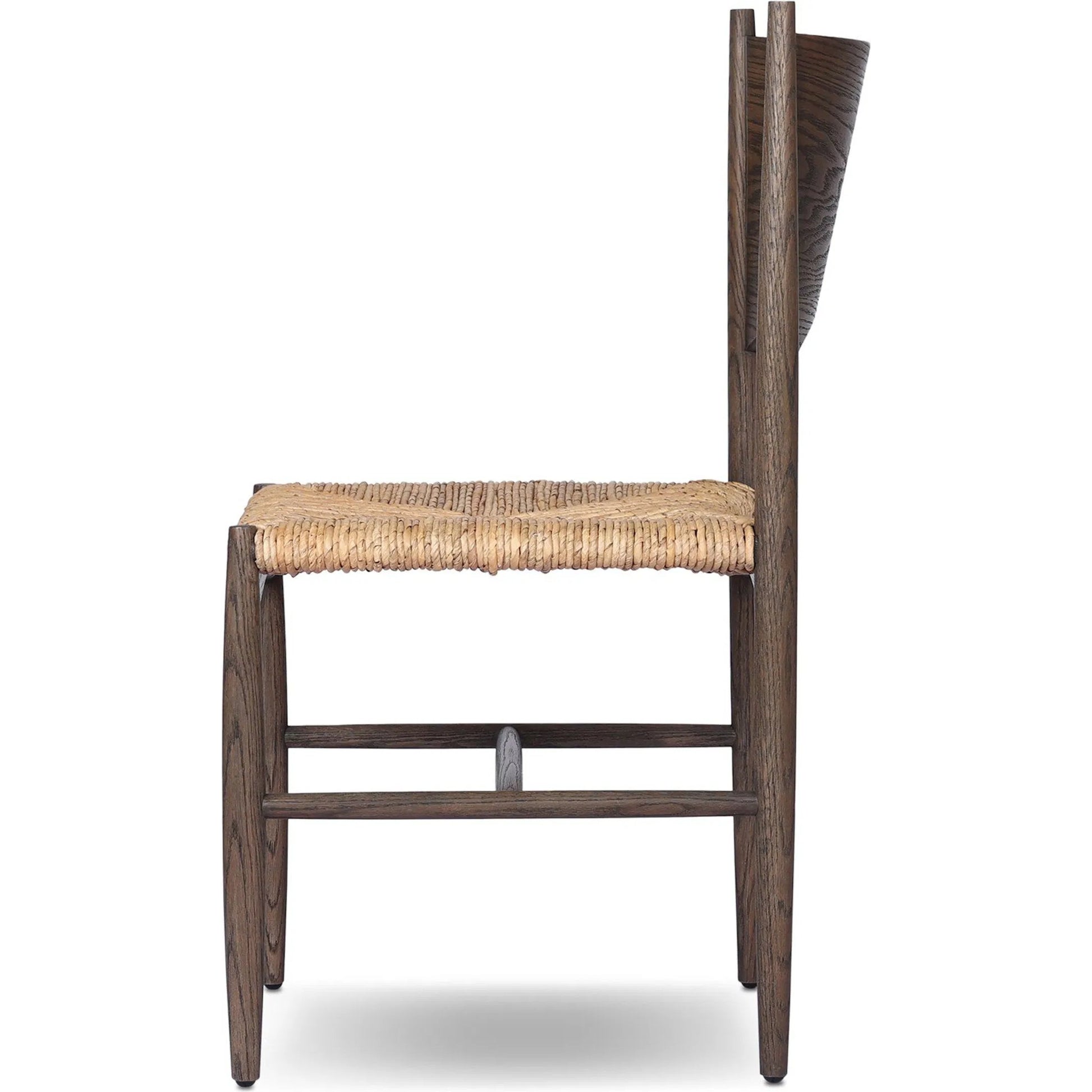 Jovan Dining Chair by Four Hands in stained saddle brown, slight dark bleaching. Made from solid oak, banana leaf in a traditional style.