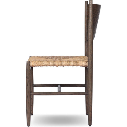 Jovan Dining Chair by Four Hands in stained saddle brown, slight dark bleaching. Made from solid oak, banana leaf in a traditional style.