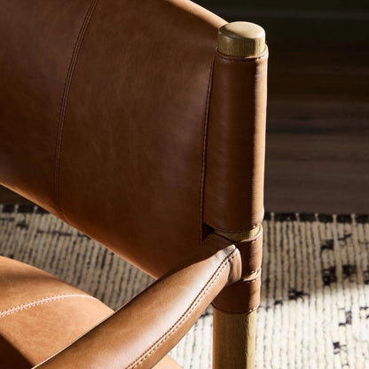 Adaline Dining Armchair by Four Hands in sonoma chestnut, natural oak. Made from top grain leather, solid oak in a transitional style.