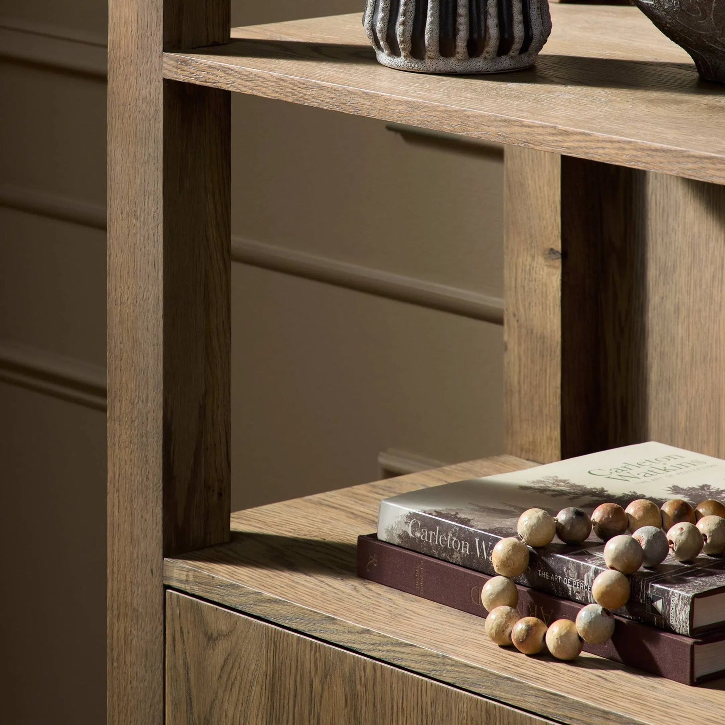 012 SI-2635274 | Closeup | Bedford Bookcase by Four Hands in warm natural oak, warm natural oak veneer. Made from solid oak, thick oak veneer in a unique style.
