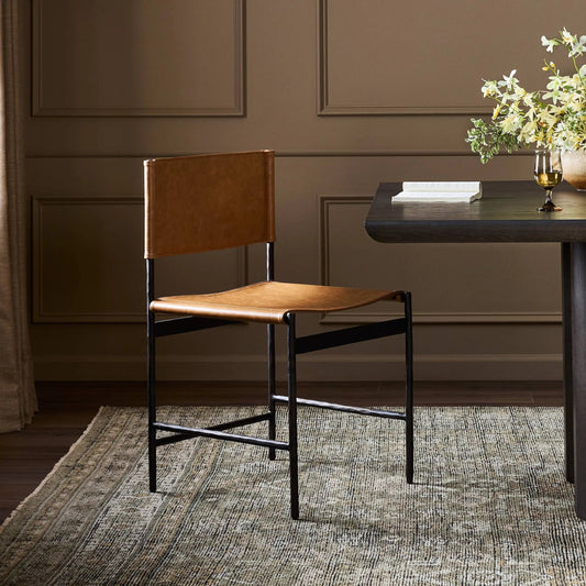 Marlon Dining Chair by Four Hands in sonoma butterscotch, hammered black. Made from top grain leather, iron in a unique style.