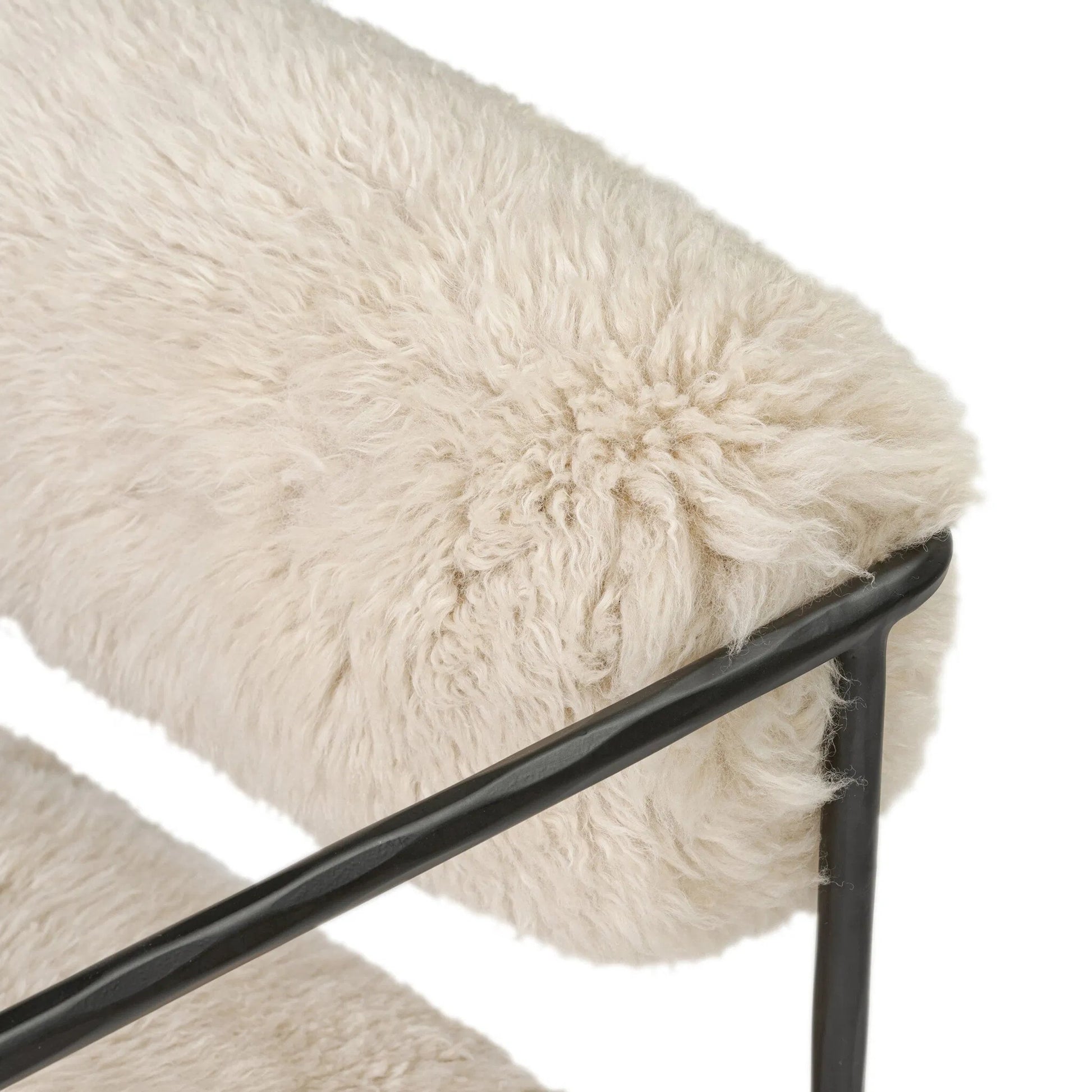 Fenn Chair by Four Hands in champagne mongolian fur, hammered iron. Made from 100% wool fur, iron in a modern style.