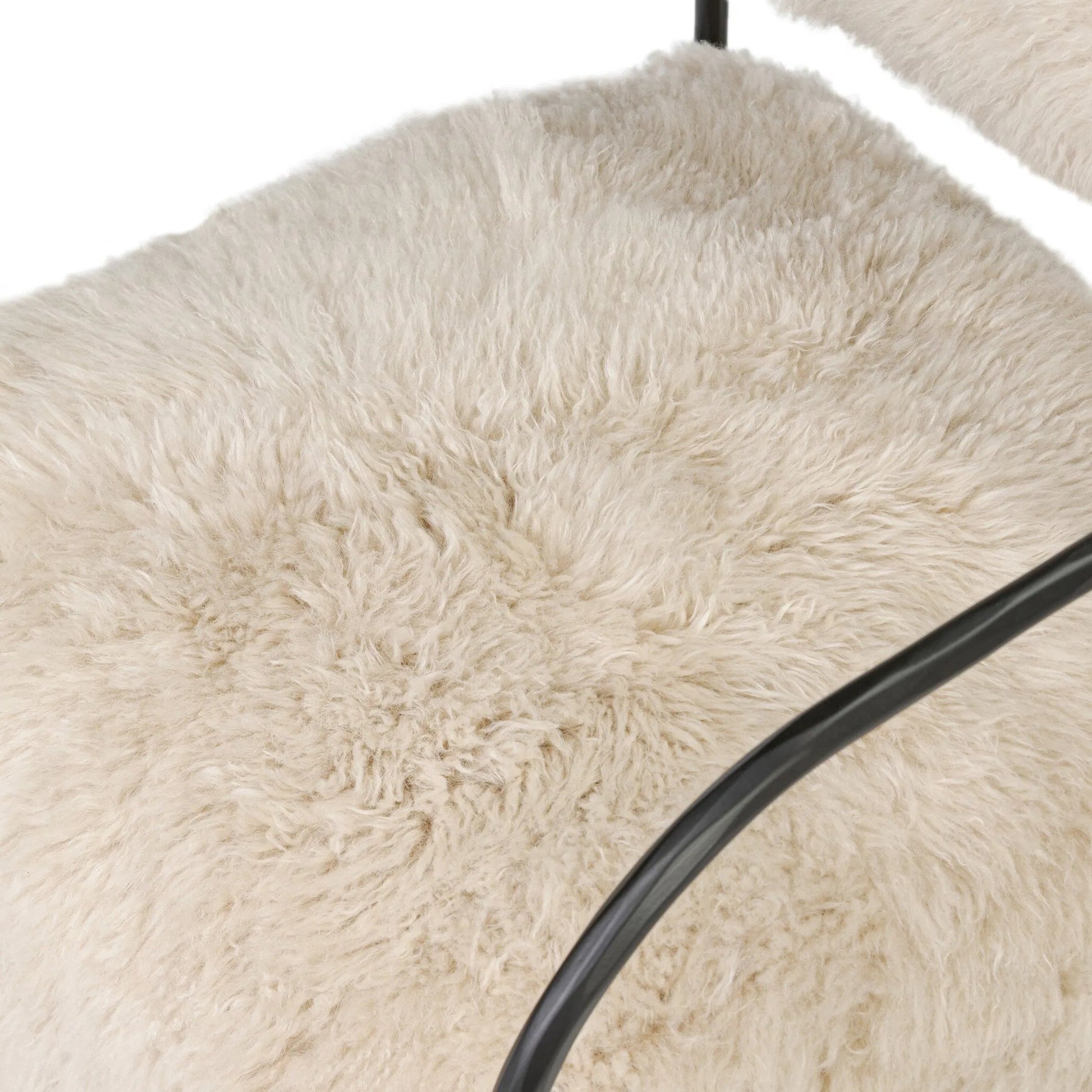 Fenn Chair by Four Hands in champagne mongolian fur, hammered iron. Made from 100% wool fur, iron in a modern style.