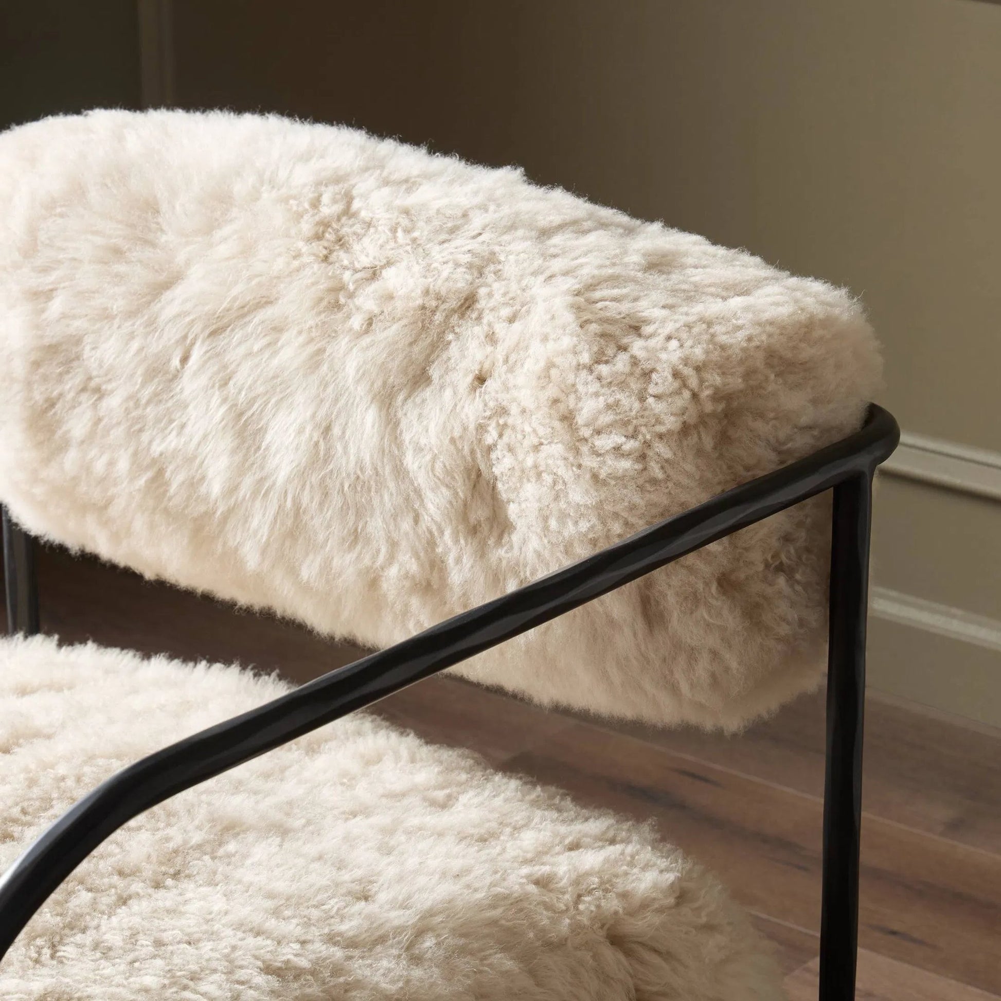 Fenn Chair by Four Hands in champagne mongolian fur, hammered iron. Made from 100% wool fur, iron in a modern style.