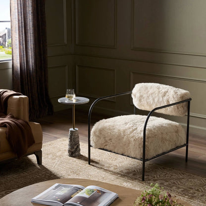 Fenn Chair by Four Hands in champagne mongolian fur, hammered iron. Made from 100% wool fur, iron in a modern style.