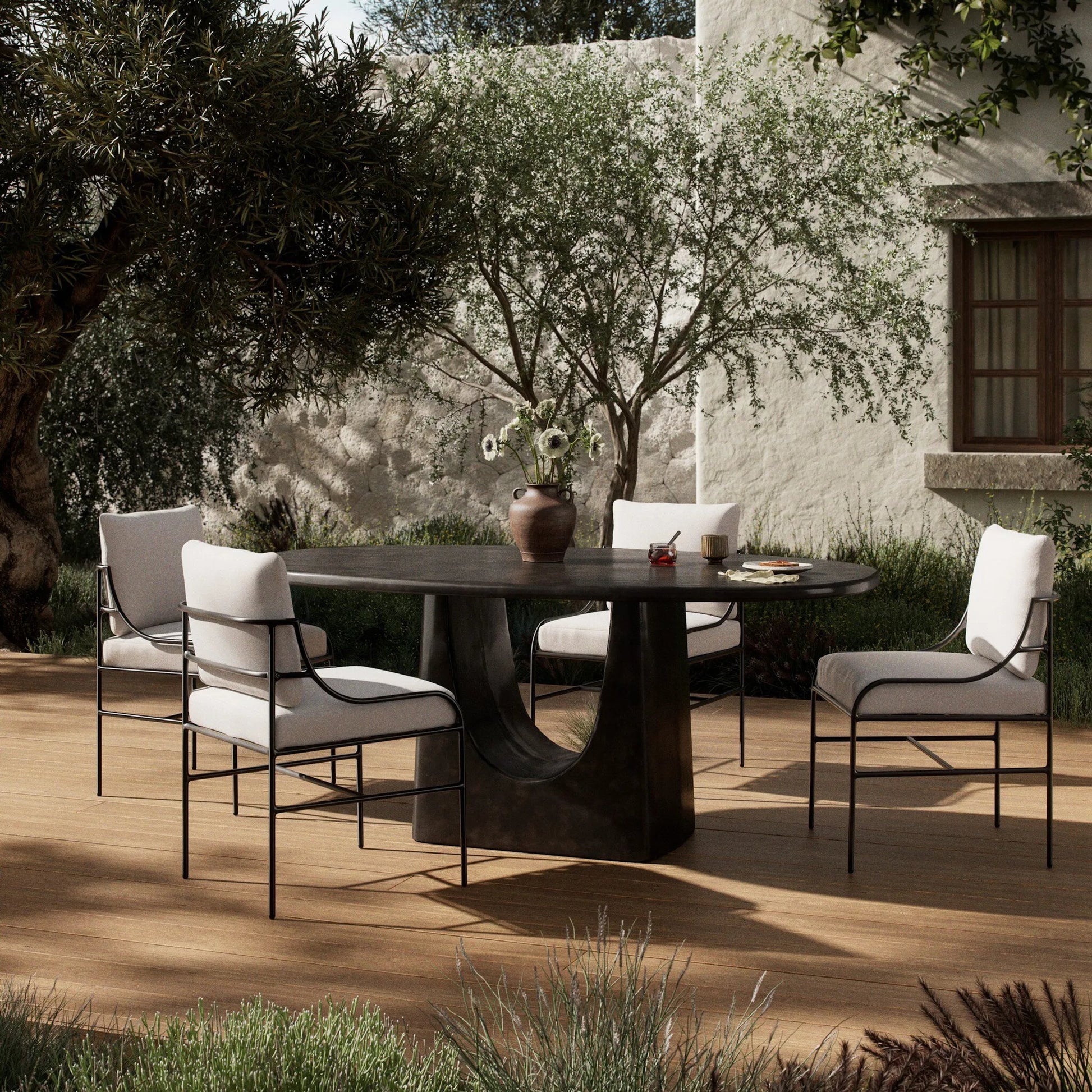 Amato Outdoor Dining Table-72" by Four Hands in antique rust. Made from aluminum in a modern style.