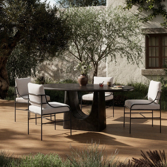 Amato Outdoor Dining Table-72" by Four Hands in antique rust. Made from aluminum in a unique style.