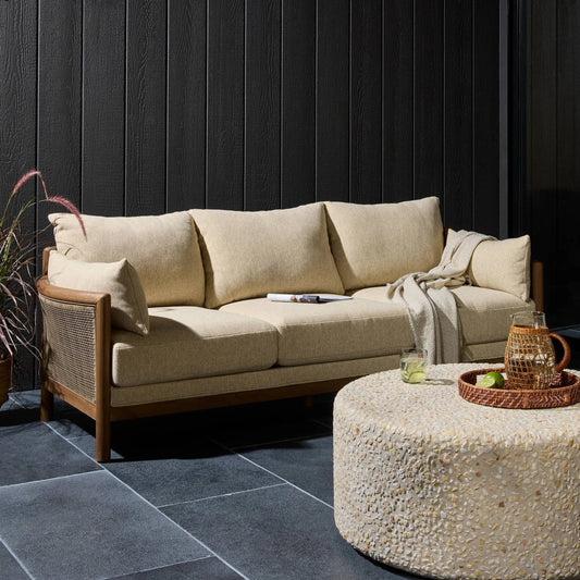 Barbosa Outdoor Sofa-86" by Four Hands in concha beige, stained toasted brown-fsc, washed brown weave. Made from 100% olefin, solid fsc®-certified teak, 100% polyethylene in a coastal style.