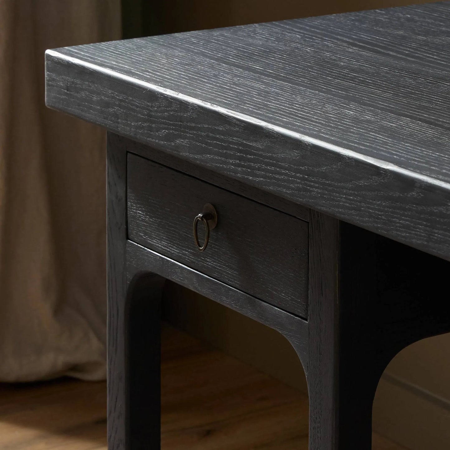 009 SI-2513234 | Closeup | Avedon Desk by Four Hands in aged black oak, aged black oak veneer. Made from solid oak, thick oak veneer in a transitional style.