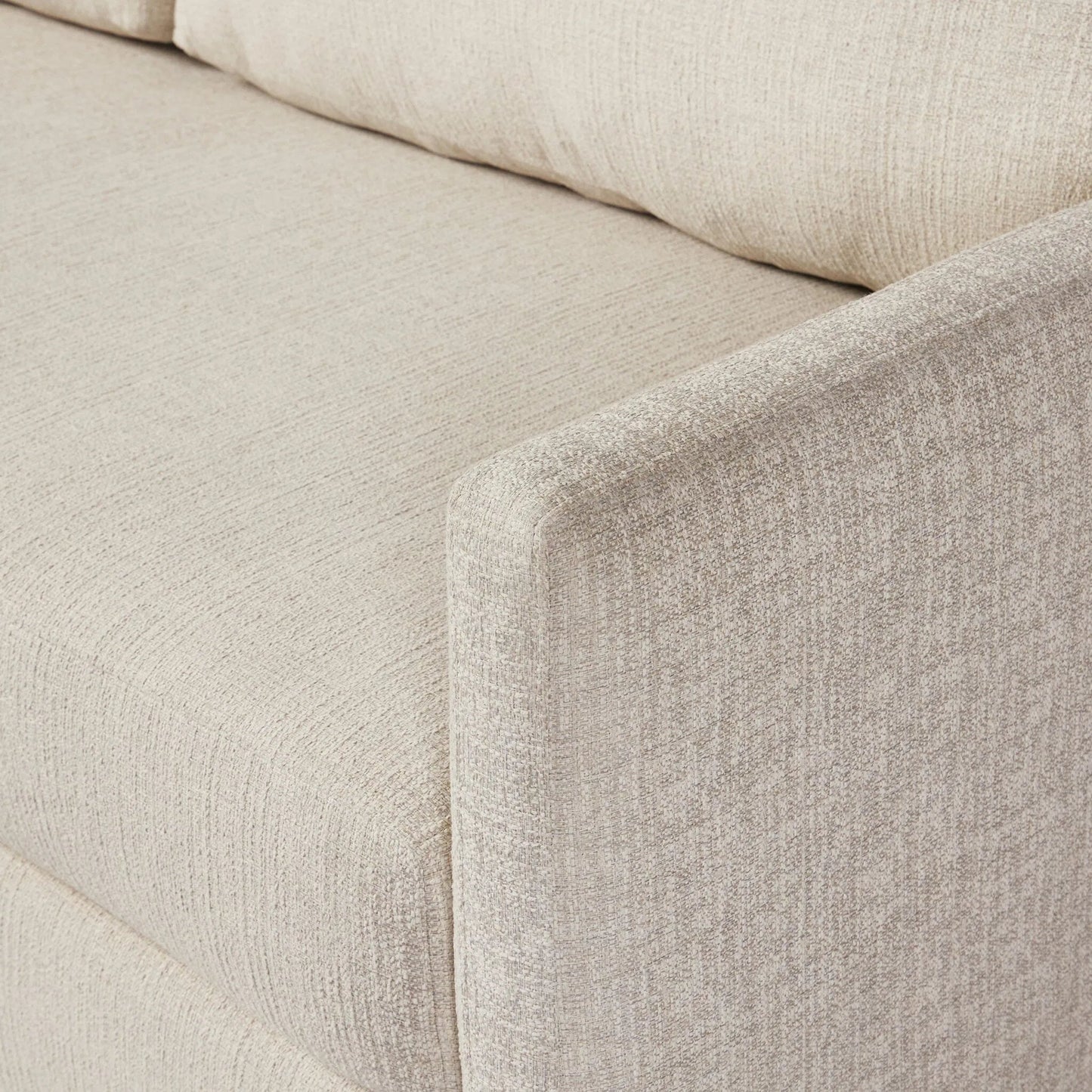 005 SI-2635371 | Closeup | Wickham 2-Piece Sleeper Sectional by Four Hands in alameda snow, ebony, ronan linen. Made from 88% olefin, 11% polyester (uv), 1% polyester, solid maple, faux leather in a unique style.