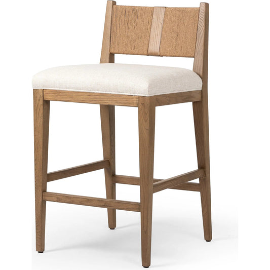 Selene Counter Stool by Four Hands in dover crescent, aged oak, natural paper cord. Made from 71% viscose (rayon), 17% polyester, 12% flax/linen, solid oak, rush in a unique style.