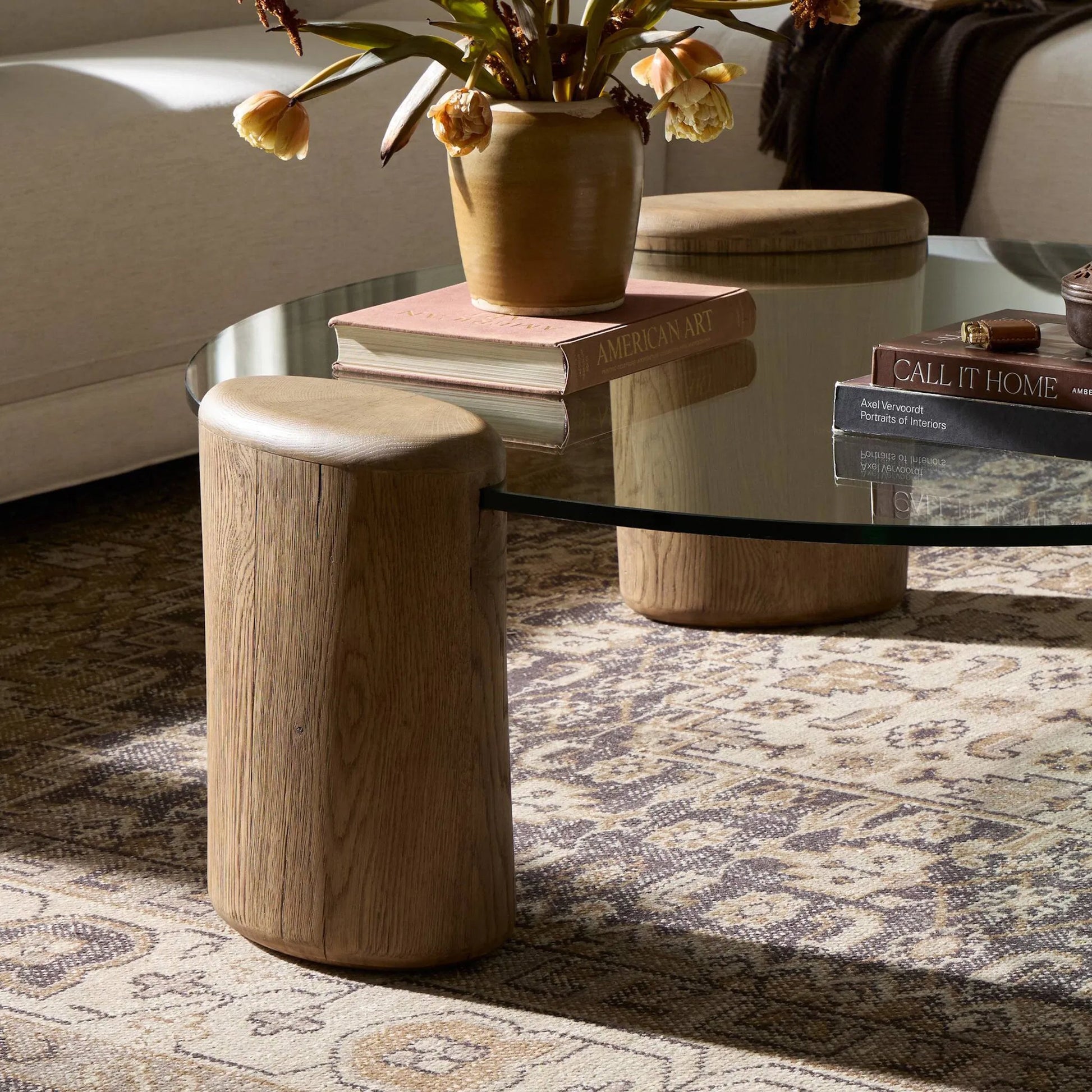 Juno Coffee Table by Four Hands in tempered glass, drifted oak veneer. Made from tempered glass, thick oak veneer in a transitional style.