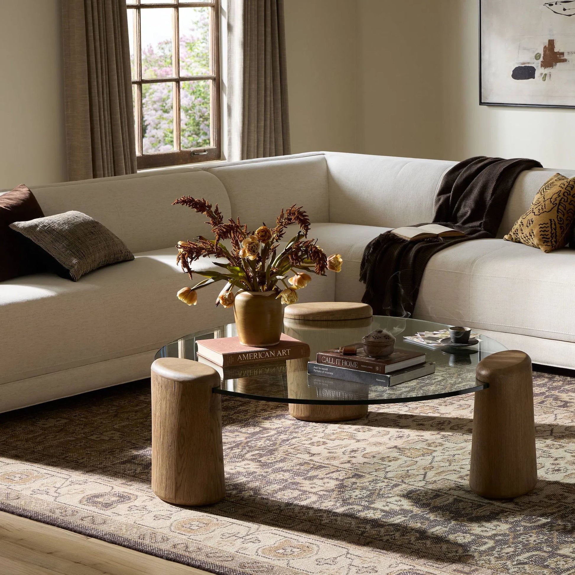 Juno Coffee Table by Four Hands in tempered glass, drifted oak veneer. Made from tempered glass, thick oak veneer in a transitional style.