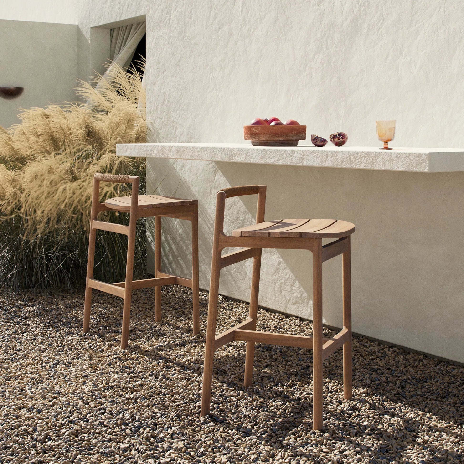 Baden Outdoor Bar Stool by Four Hands in textured sand, fine sanded teak-fsc. Made from 100% polyethylene, solid fsc®-certified teak in a transitional style.