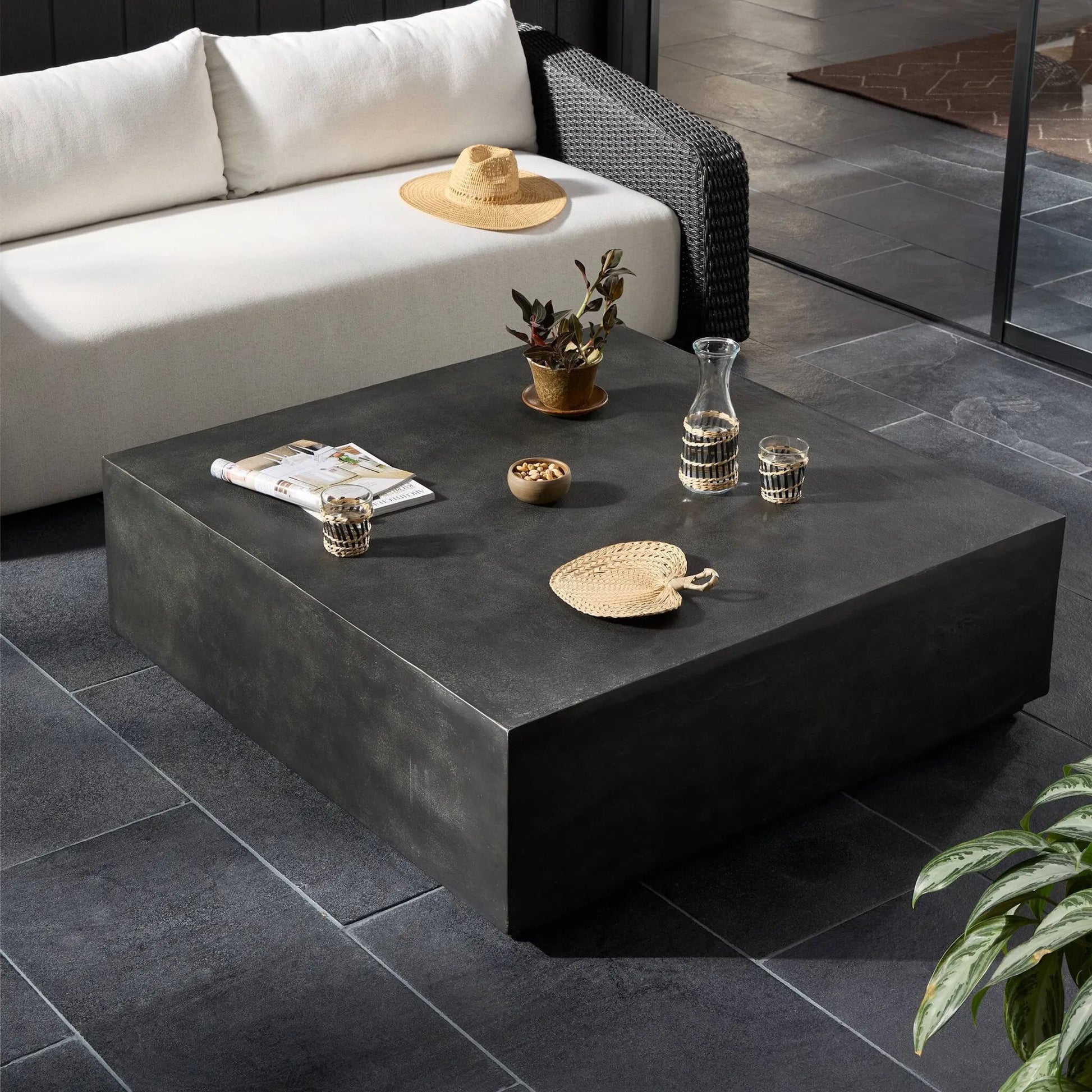 Graso Outdoor Square Coffee Table by Four Hands in aged grey. Made from aluminum in a modern style.
